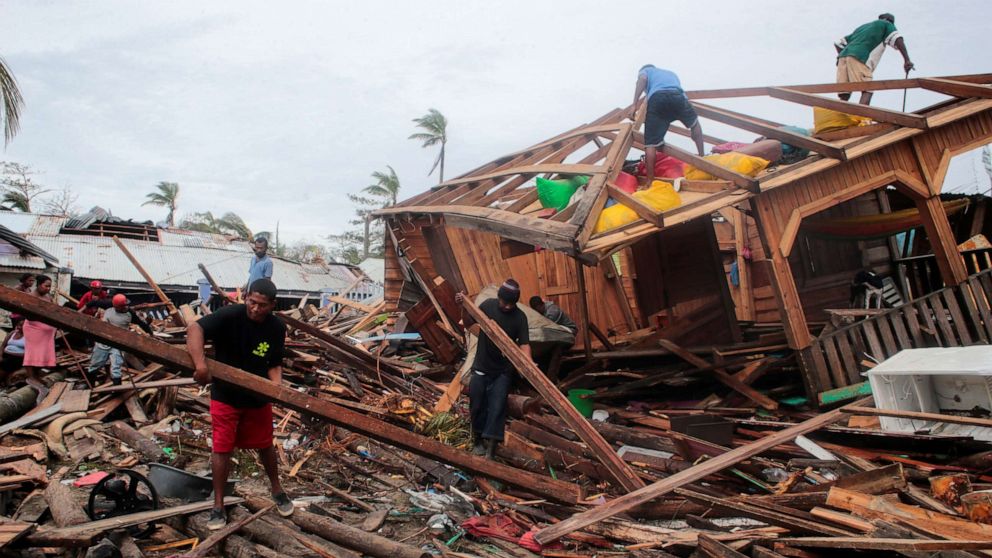 PHOTO: Residents remove debris from their houses destroyed by the passing of Hurricane Iota, in Puerto Cabezas, Nicaragua, Nov. 18, 2020.