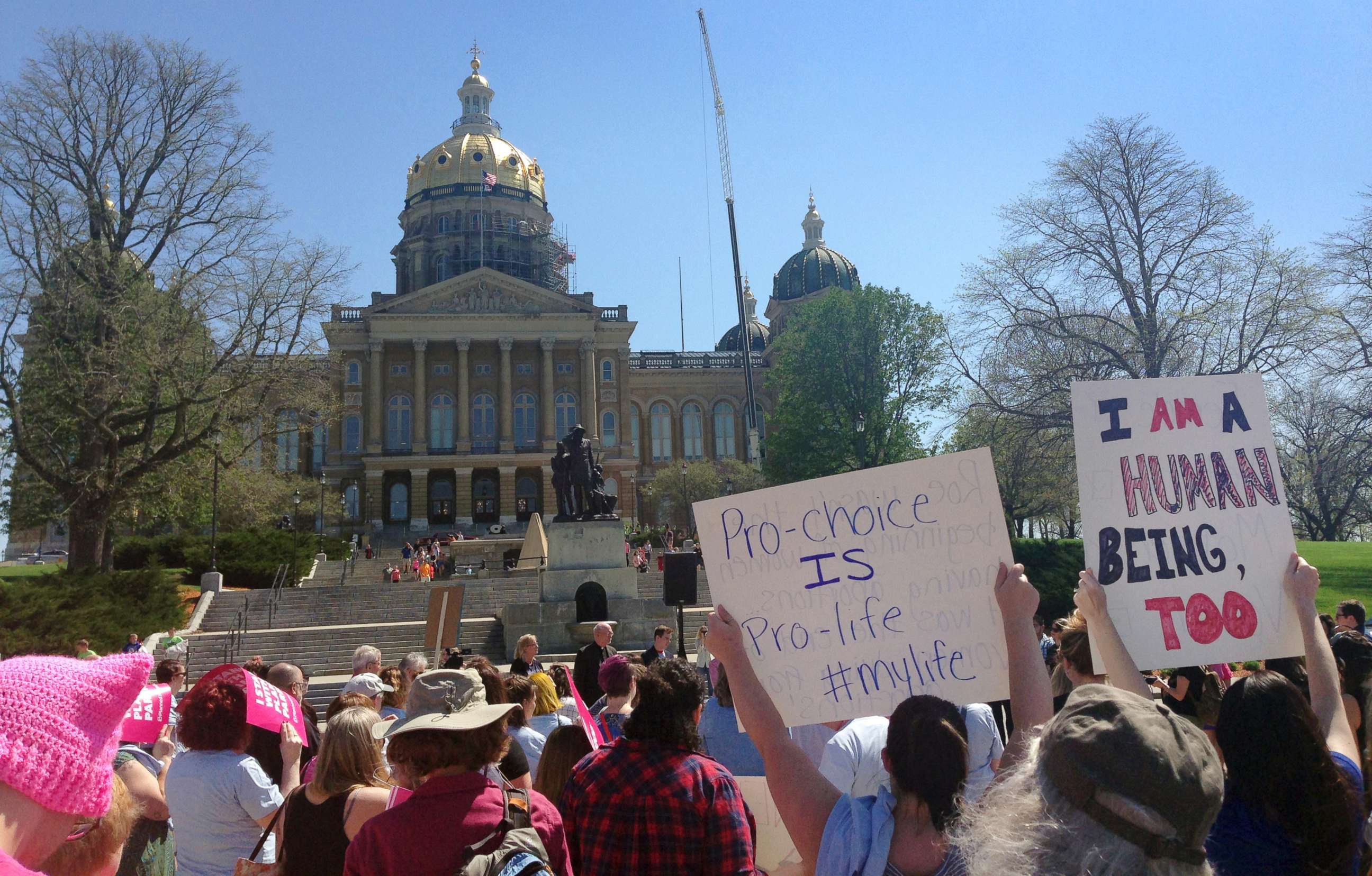 PHOTO: Planned Parenthood supporters rally outside the Iowa Capitol Building, May 4, 2018, in Des Moines, Iowa.