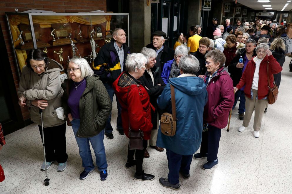 PHOTO: Local residents wait to enter an Iowa Democratic caucus at Hoover High School, Feb. 3, 2020, in Des Moines, Iowa.