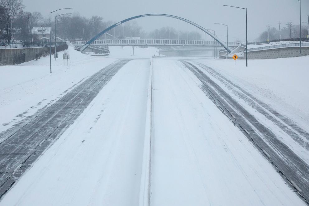 PHOTO: Single tracks move east and west on the Interstate 235 John MacVicar Freeway as winter storm Gerri dumps inches of snow with high winds on Jan. 12, 2024 in Des Moines, Iowa.