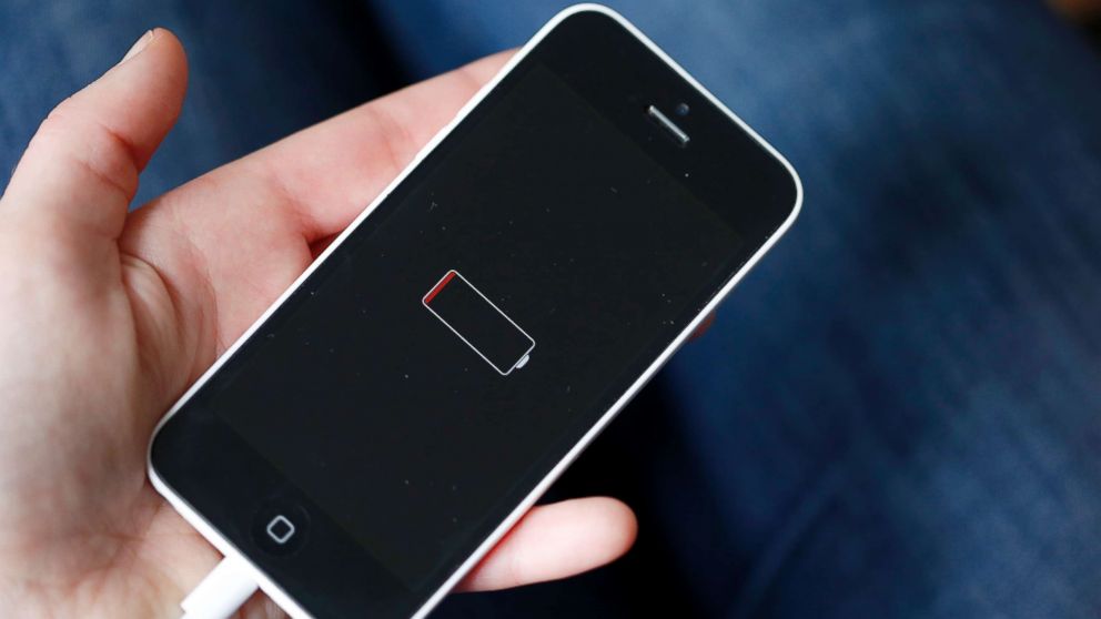 A woman holds an iPhone 5 on Dec. 23, 2017, in Paris.