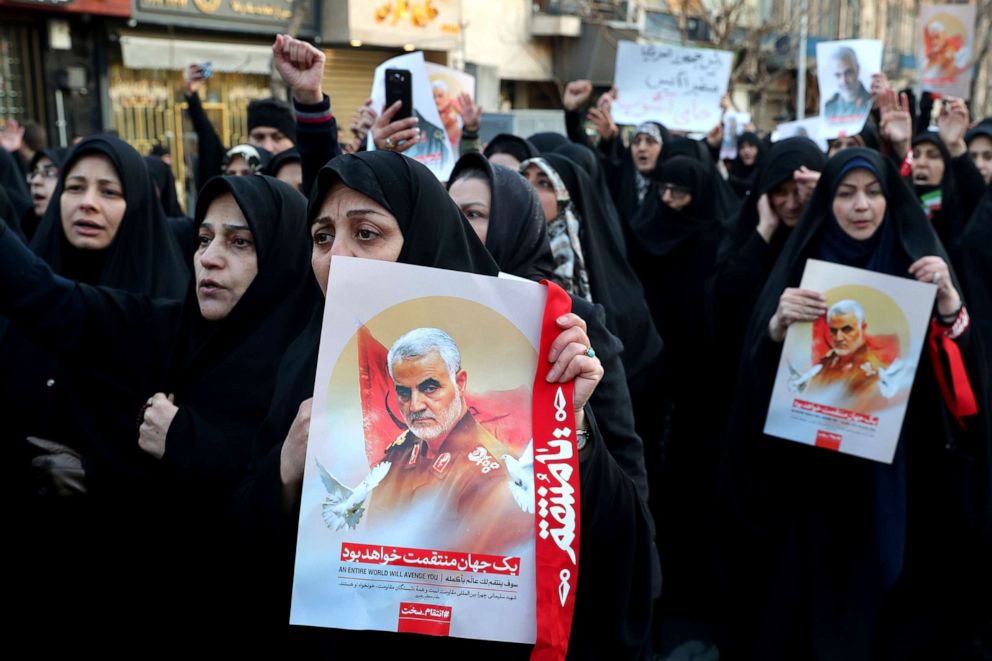 PHOTO: Demonstrators chant slogans while holding up posters of Gen. Qassem Soleimani during a protest in front of the British Embassy in Tehran, Iran, Jan. 12, 2020.