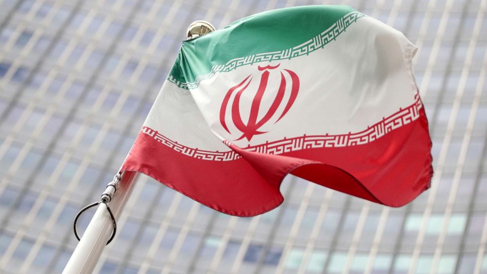 PHOTO: In this file photo the Iranian flag flutters in front the International Atomic Energy Agency headquarters in Vienna, Austria, July 10, 2019.
