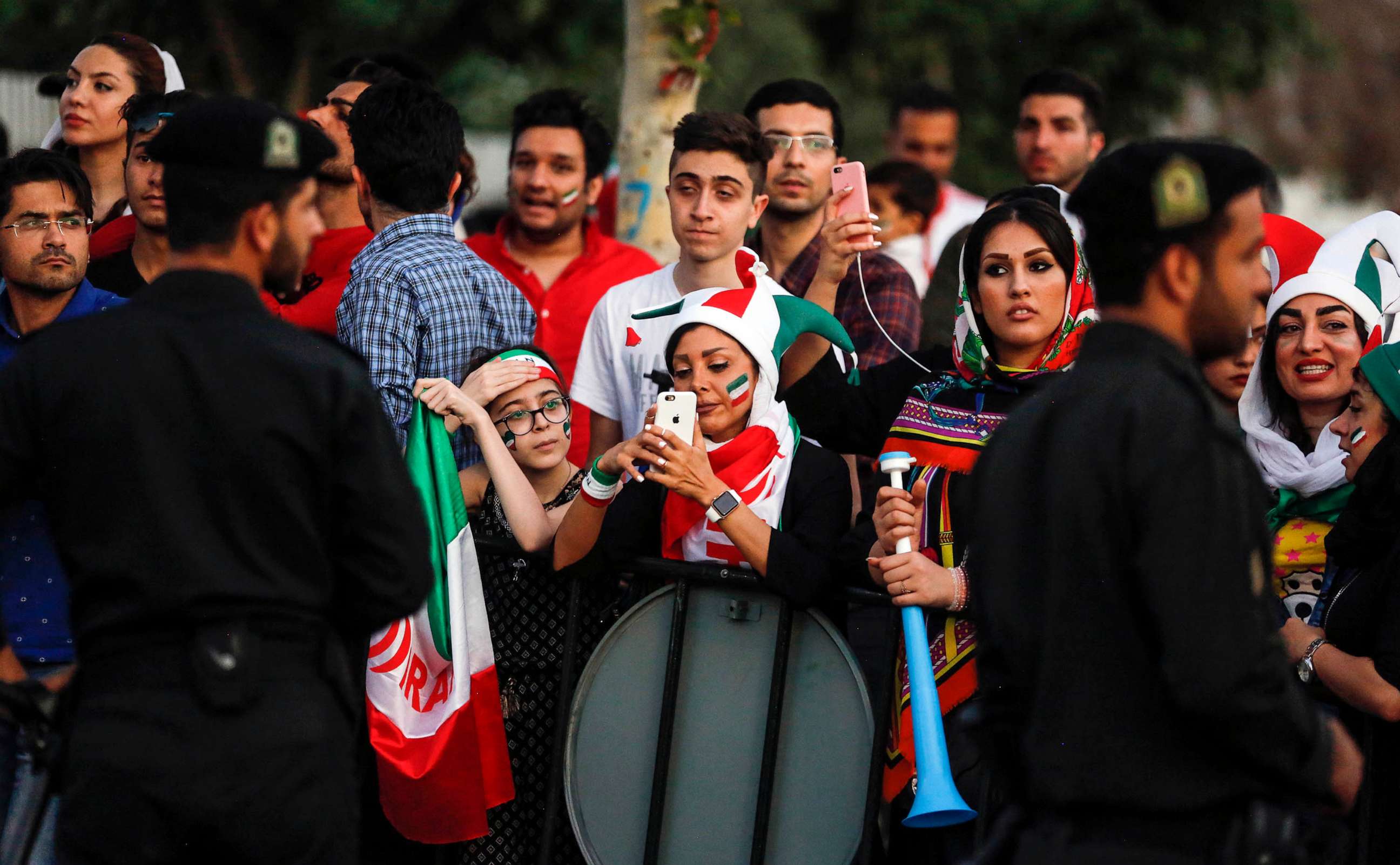 PHOTO: FILE - Iranian football supporters arrive with vuvuzelas and dressed in their national team's colours and paraphernalia outside Azadi stadium in the capital Tehran on June 20, 2018, to attend a screening of the Russia 2018 World Cup Group B.