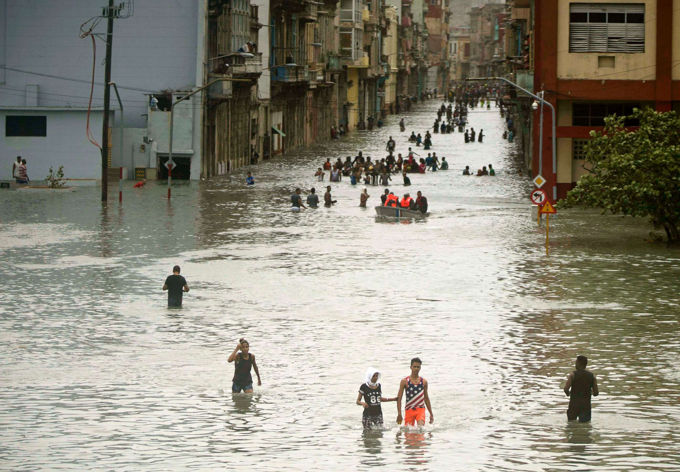 PHOTO: People walk through flooded streets in Havana after Hurricane Irma passed Cuba, Sept. 10, 2017. 