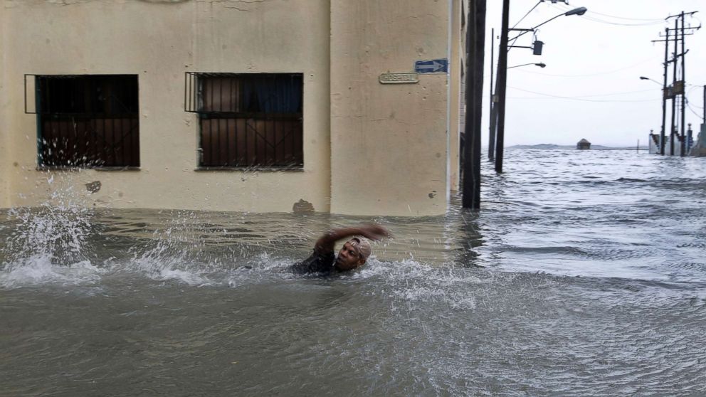 PHOTO: A man swims through a flooded street in Havana, Cuba, Sept. 10, 2017. 