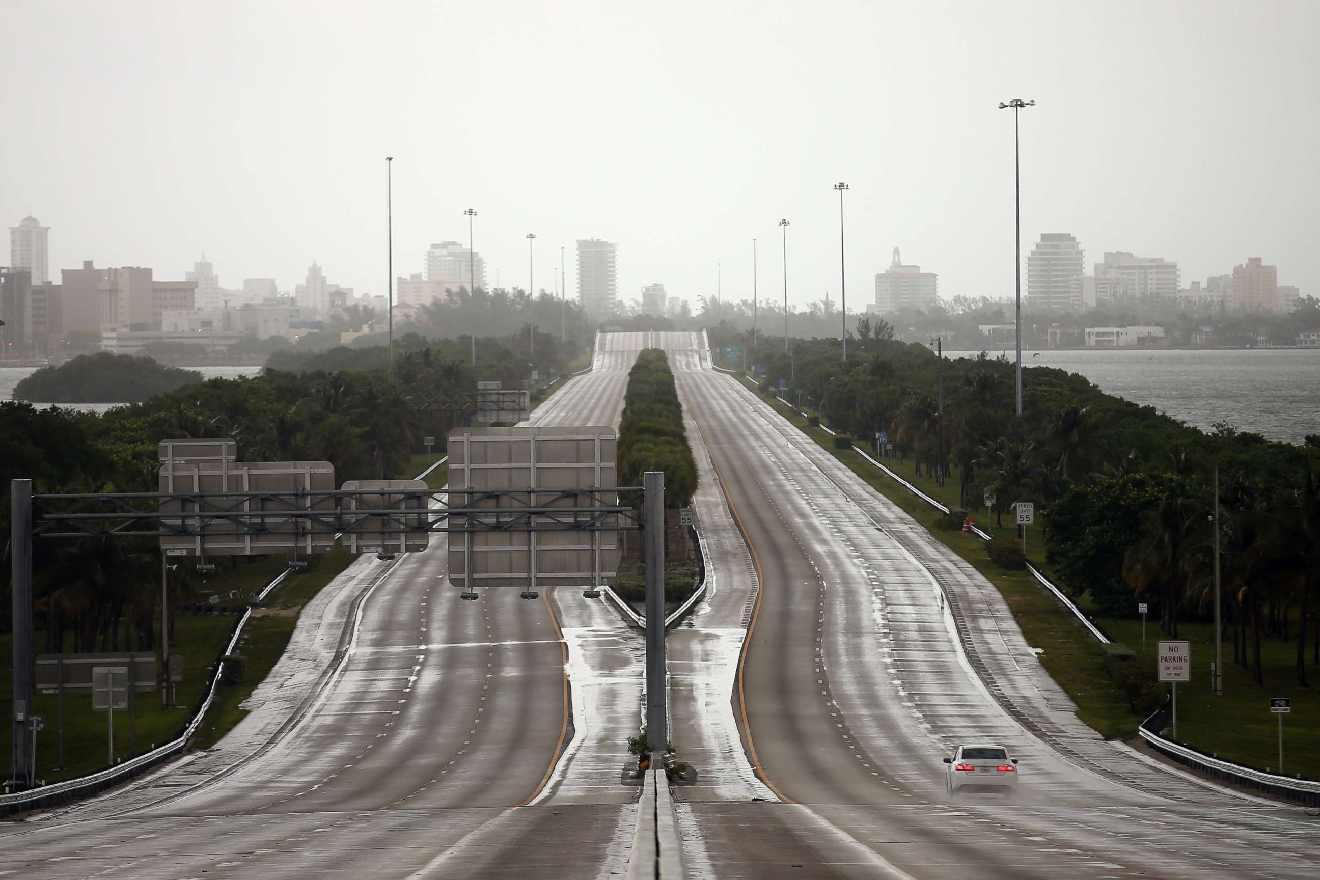 PHOTO: A car drives along an empty highway in Miami before the arrival of Hurricane Irma to south Florida, Sept. 9, 2017.