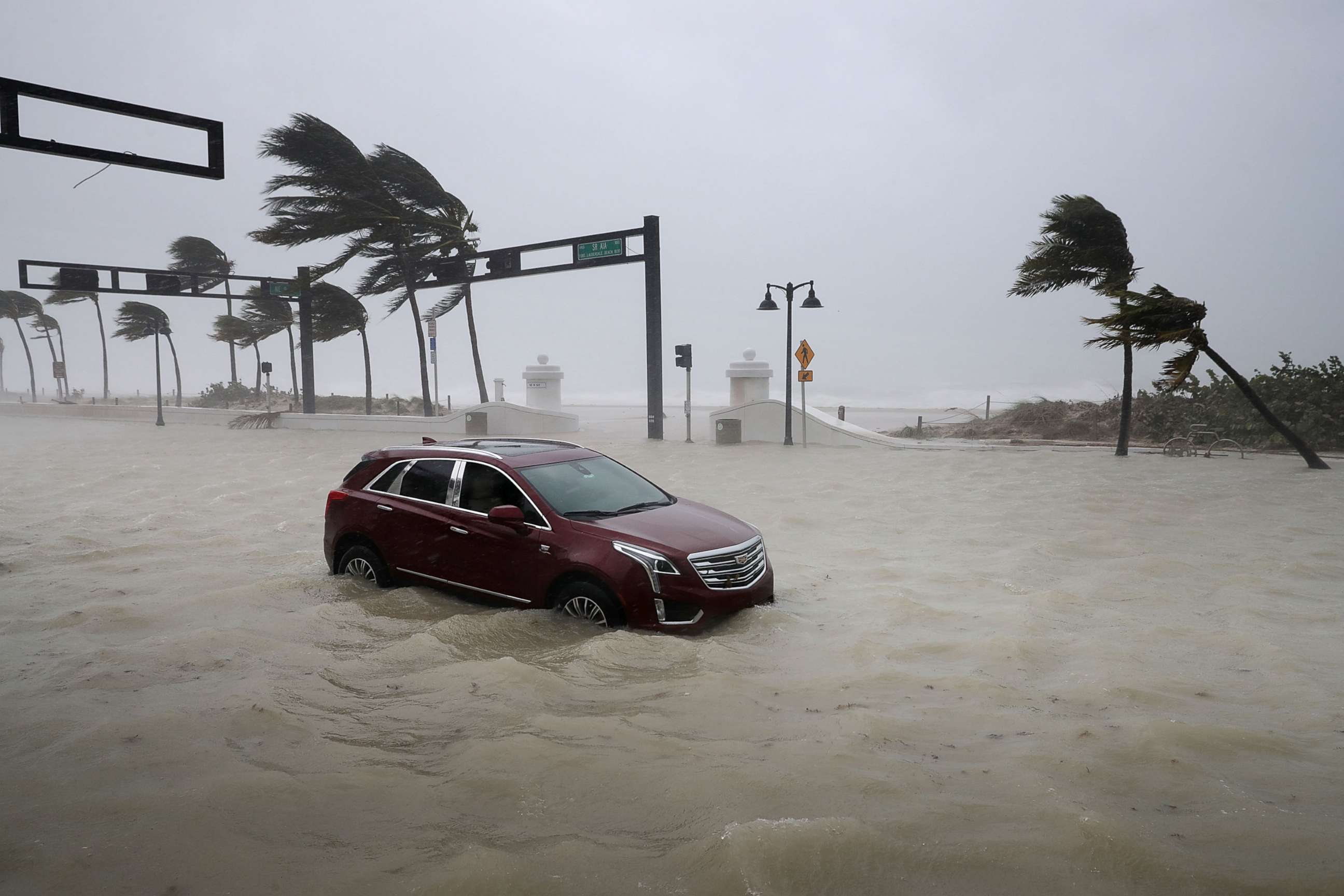 PHOTO: A car sits abandoned in storm surge waters along North Fort Lauderdale Beach Boulevard as Hurricane Irma hits the southern part of the state Sept. 10, 2017 in Fort Lauderdale, Fla.