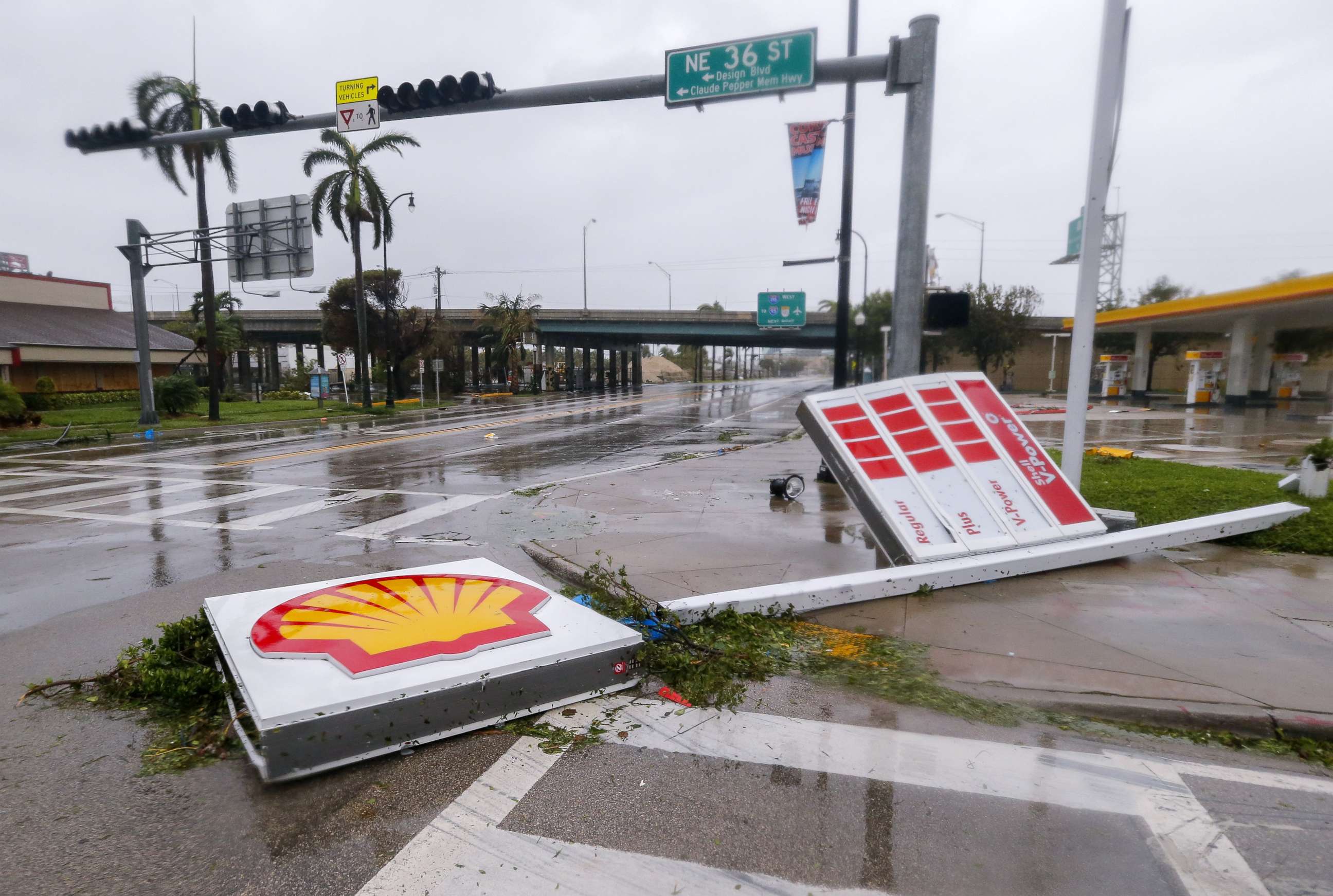 PHOTO: A gas station sign lies along Biscayne Boulevard after Hurricane Irma struck in Miami, Sept. 10, 2017.