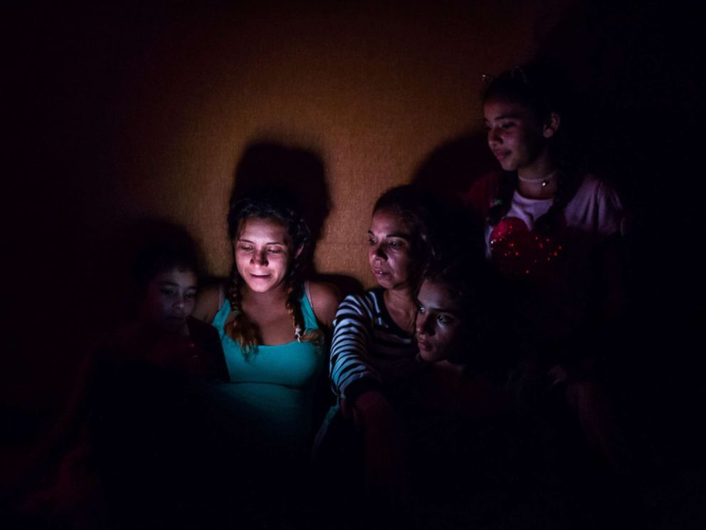 PHOTO: Members of the Pinto family gather on the ground floor of a hotel in Fort Myers, Fla., Sept. 10, 2017.