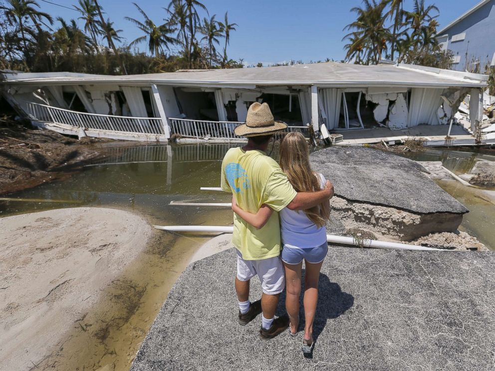 PHOTO: Mike Gilbert hugs his daughter Brooke while looking at a destroyed three-story condominium building after Hurricane Irma struck the Florida Keys in Islamorada, Fla., Sept. 12, 2017. The Gilbert family owns a unit in the building.