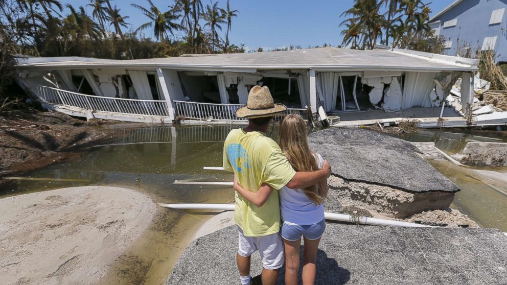 PHOTO: Mike Gilbert hugs his daughter Brooke while looking at a destroyed three-story condominium building after Hurricane Irma struck the Florida Keys in Islamorada, Fla., Sept. 12, 2017.