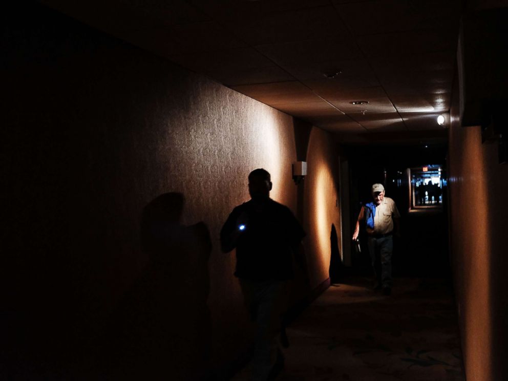 PHOTO: Hotel guests walk through dark hallways after the electricity was lost as Hurricane Irma arrives into southwest Florida, Sept. 10, 2017 in Fort Myers, Florida.