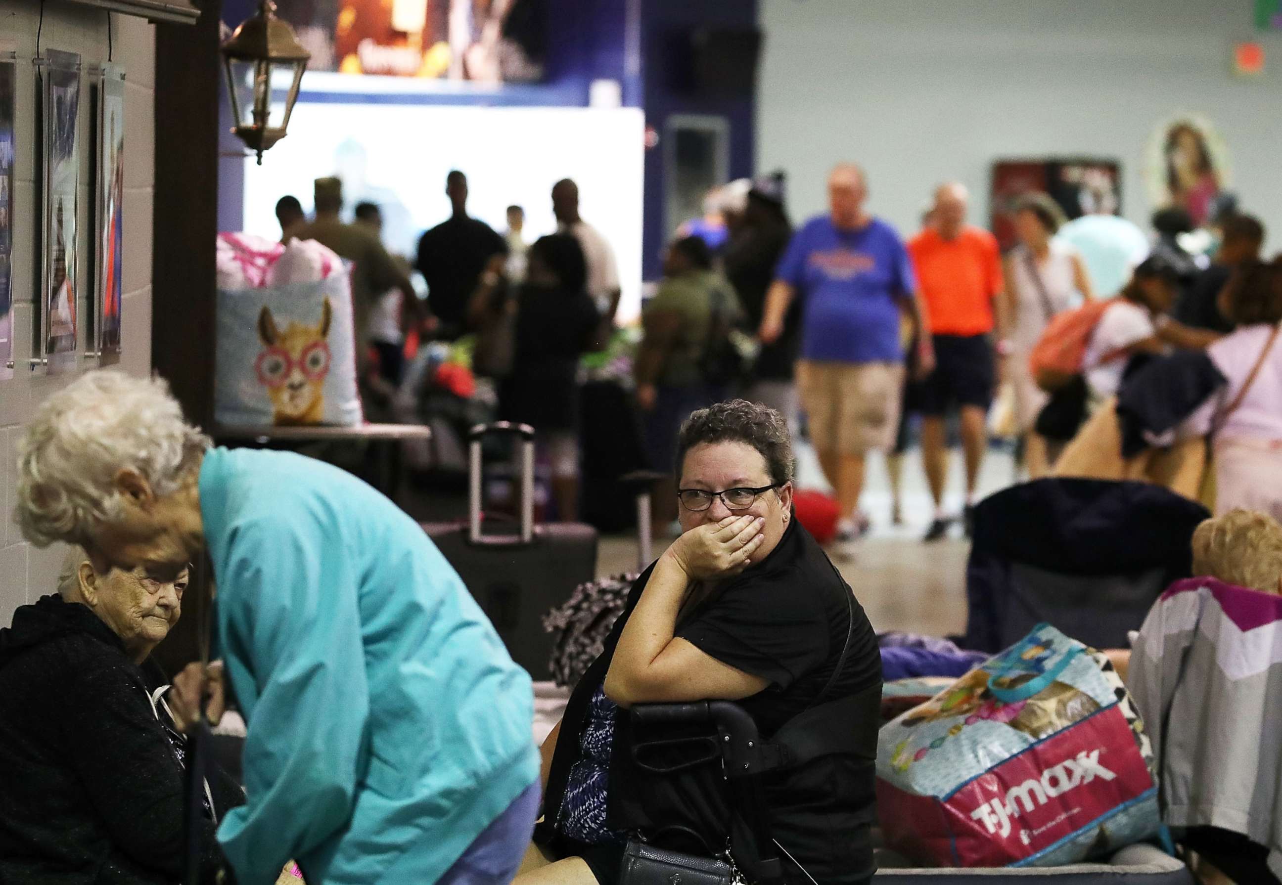PHOTO: Evacuees sit inside of the Germain Arena that is serving as a shelter from the approaching Hurricane Irma, Sept. 9, 2017 in Estero, Florida. 