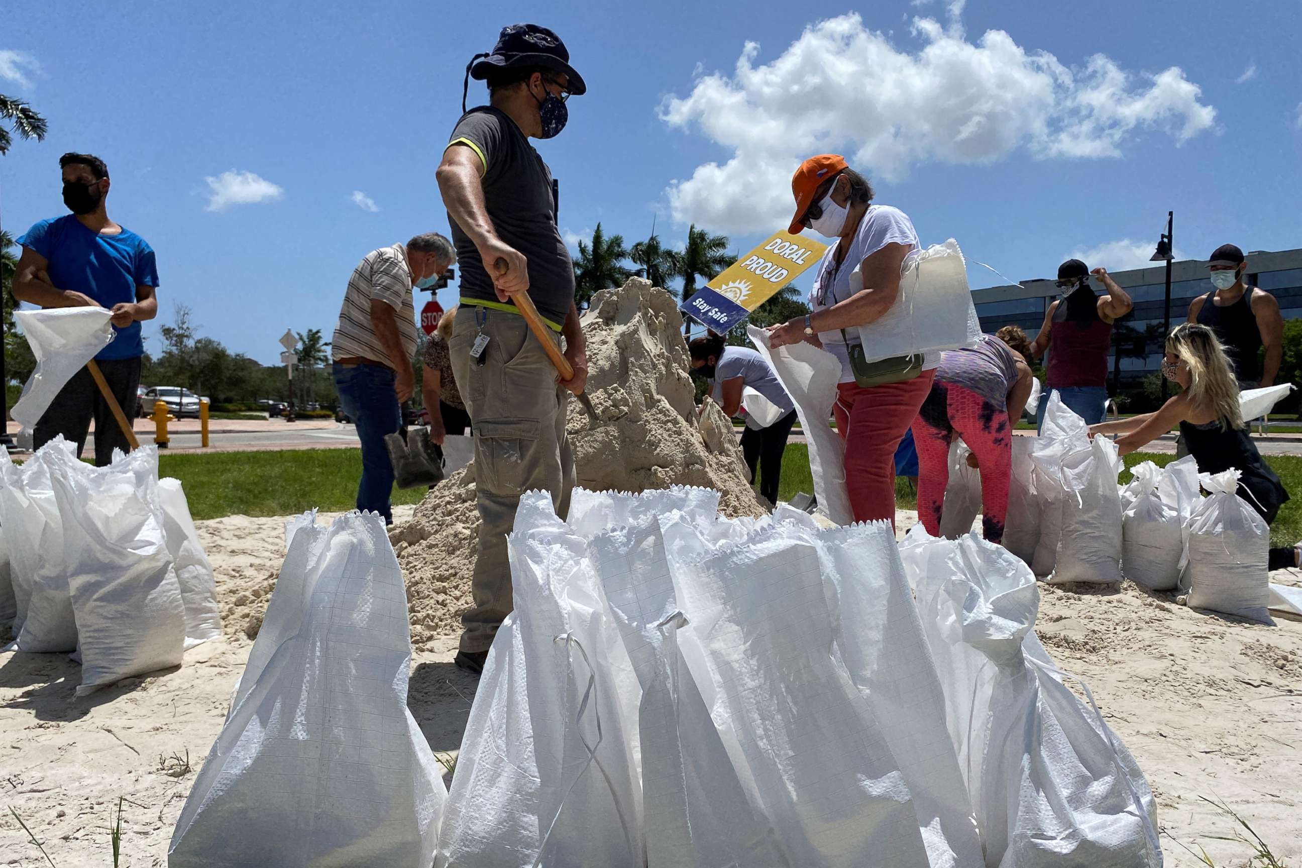 PHOTO: Residents fill and collect sand bags before the expected arrival of Hurricane Isaias in Doral, Fla., July 31, 2020.
