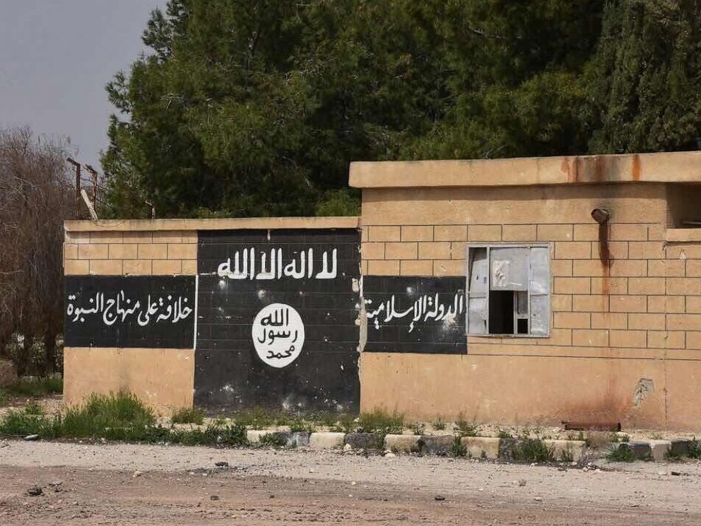 PHOTO: An ISIL flag painted on the wall in Deir Hafer, Aleppo Governorate captured by the Syrian Arab Republics army on March 30, 2017.