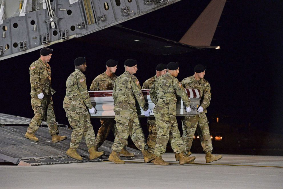 PHOTO: A U.S. Army carry team transfers the remains of Army Staff Sgt. Dustin Wright at Dover Air Force Base in Del., Oct. 5, 2017. Staff Sgt. Wright was one the 4 soldiers killed in the attack on US an Nigerien forces in southwest Niger on Oct. 4, 2017.