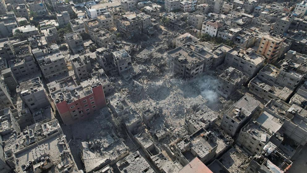 PHOTO: Palestinians gather at the site of Israeli strikes on houses in Bureij in the central Gaza Strip, Nov. 2, 2023.