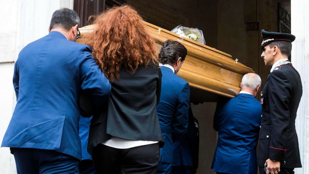 PHOTO: Carabinieri officer Mario Cerciello Rega's wife, Rosa Maria, follows the coffin of her husband as it arrives to be laid in state, in Rome, July 28, 2019. 