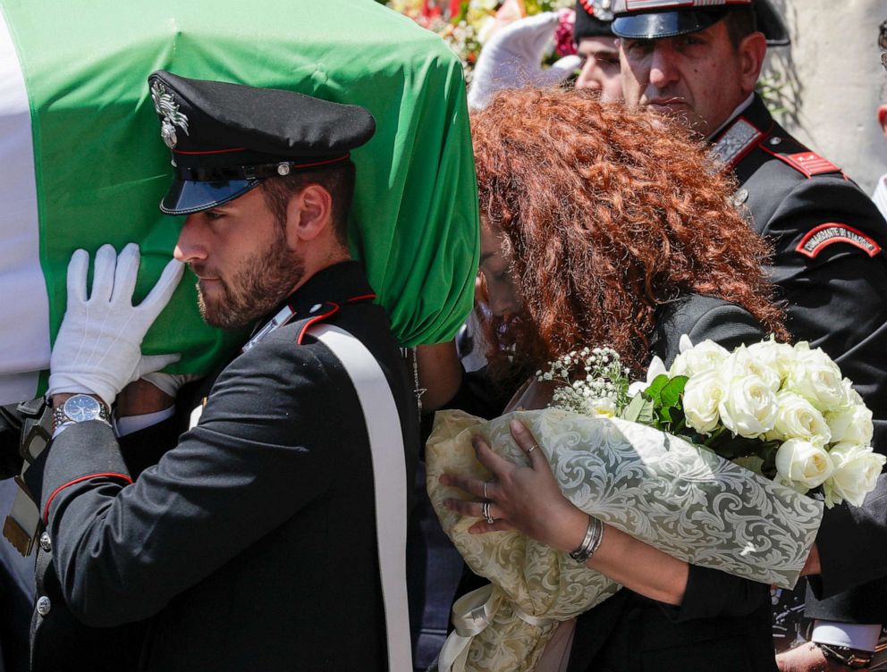 PHOTO: Carabinieri officer Mario Cerciello Rega's wife, Rosa Maria, right, follows the coffin containing the body of her husband during his funeral in his hometown of Somma Vesuviana, near Naples, Italy, July 29, 2019.