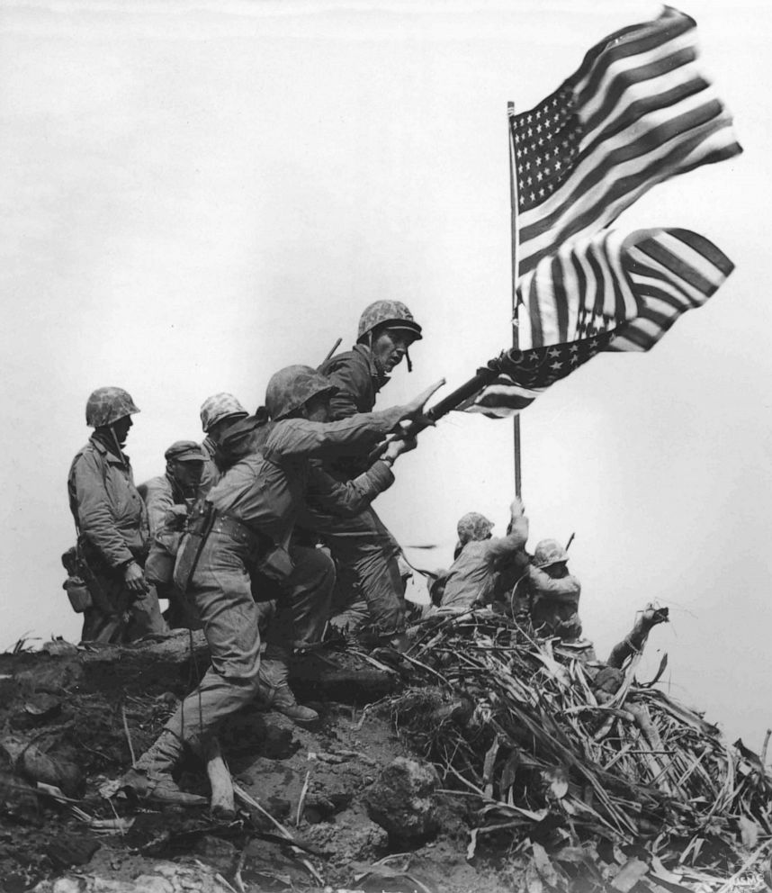 PHOTO: U.S. Marines raise a large American flag to replace a smaller flag first raised at the summit of Mount Suribachi on Iwo Jima, Feb. 23, 1945.