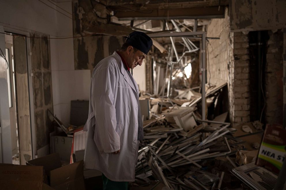 PHOTO: Ukrainian doctor Yurii Kuznetsov pauses in the destroyed surgery section of the hospital in Izium, Ukraine, Feb. 19, 2023.