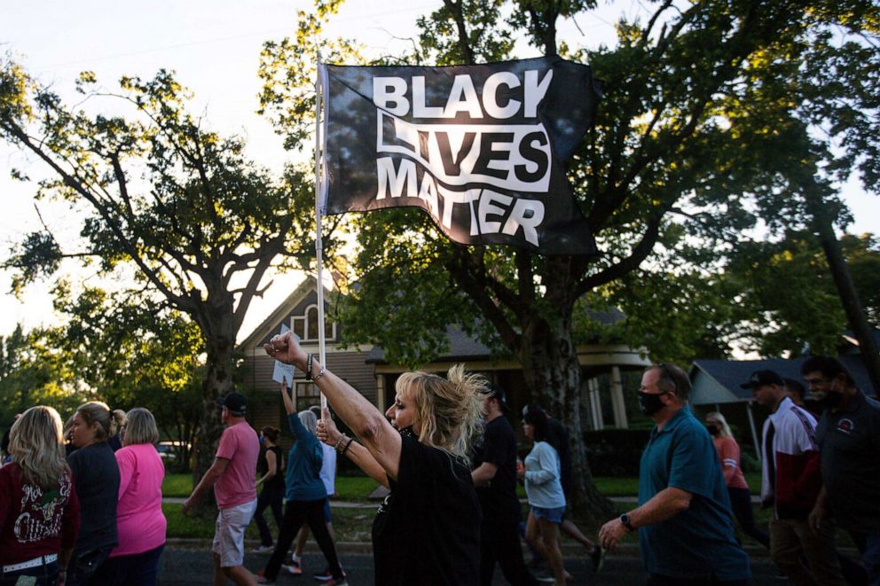 PHOTO: People gather for a march, rally and candle light vigil in honor Jonathan Price on Oct. 5, 2020 in Wolfe City, Texas.