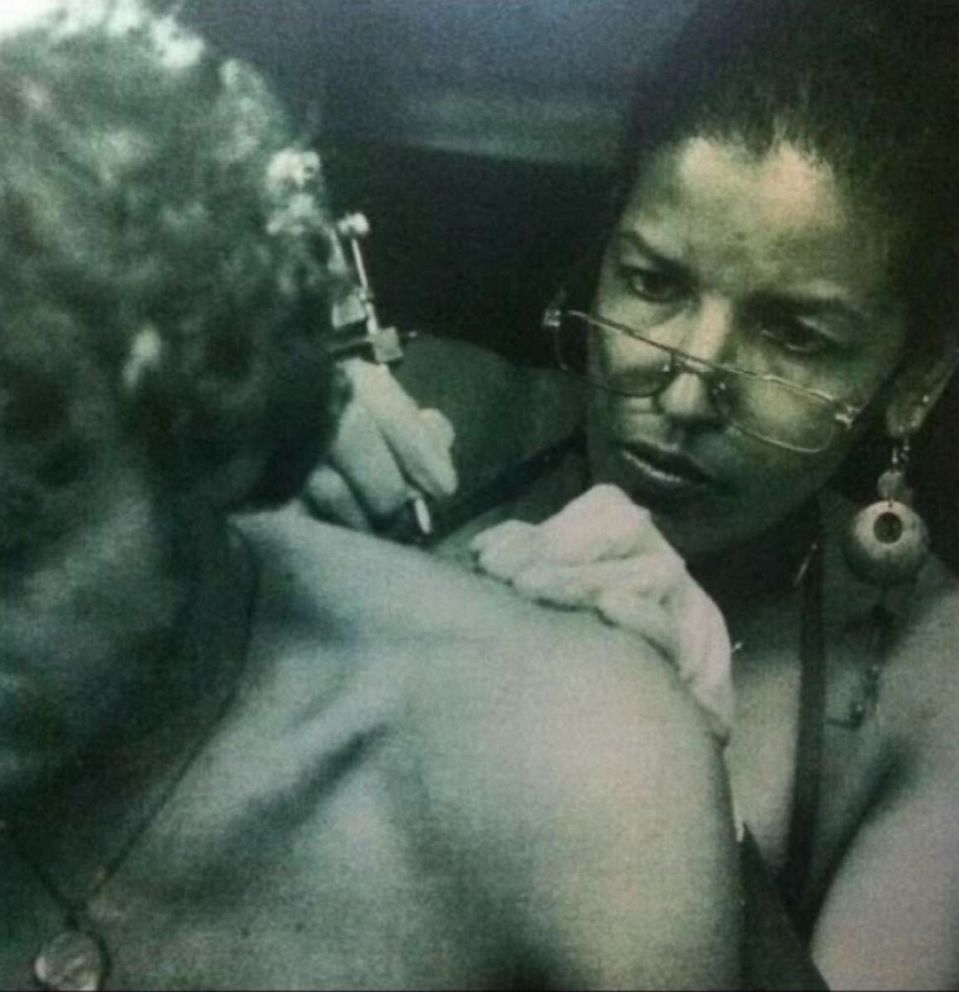 PHOTO: Jacci Gresham, one of America's first Black female tattoo artists, gives a tattoo in the 1980s'.