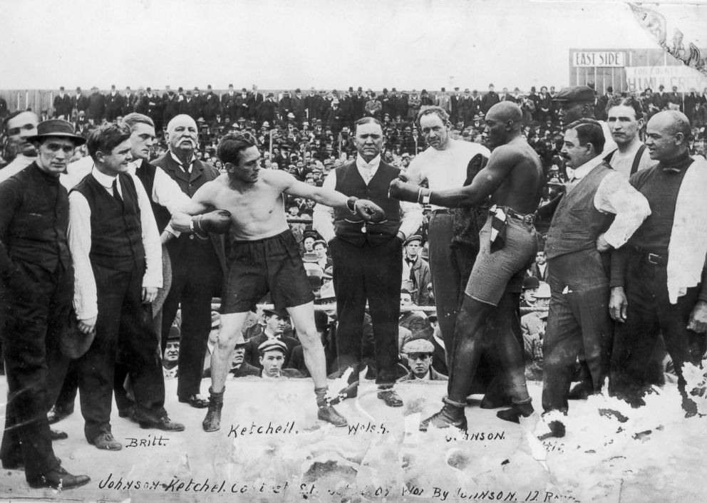 PHOTO: American boxers Stanley Ketchell (1886-1910) (L) and Jack Johnson (1878-1946) touch gloves while squaring off in the boxing ring before their fight in San Francisco, Calif. Oct. 10, 1909.