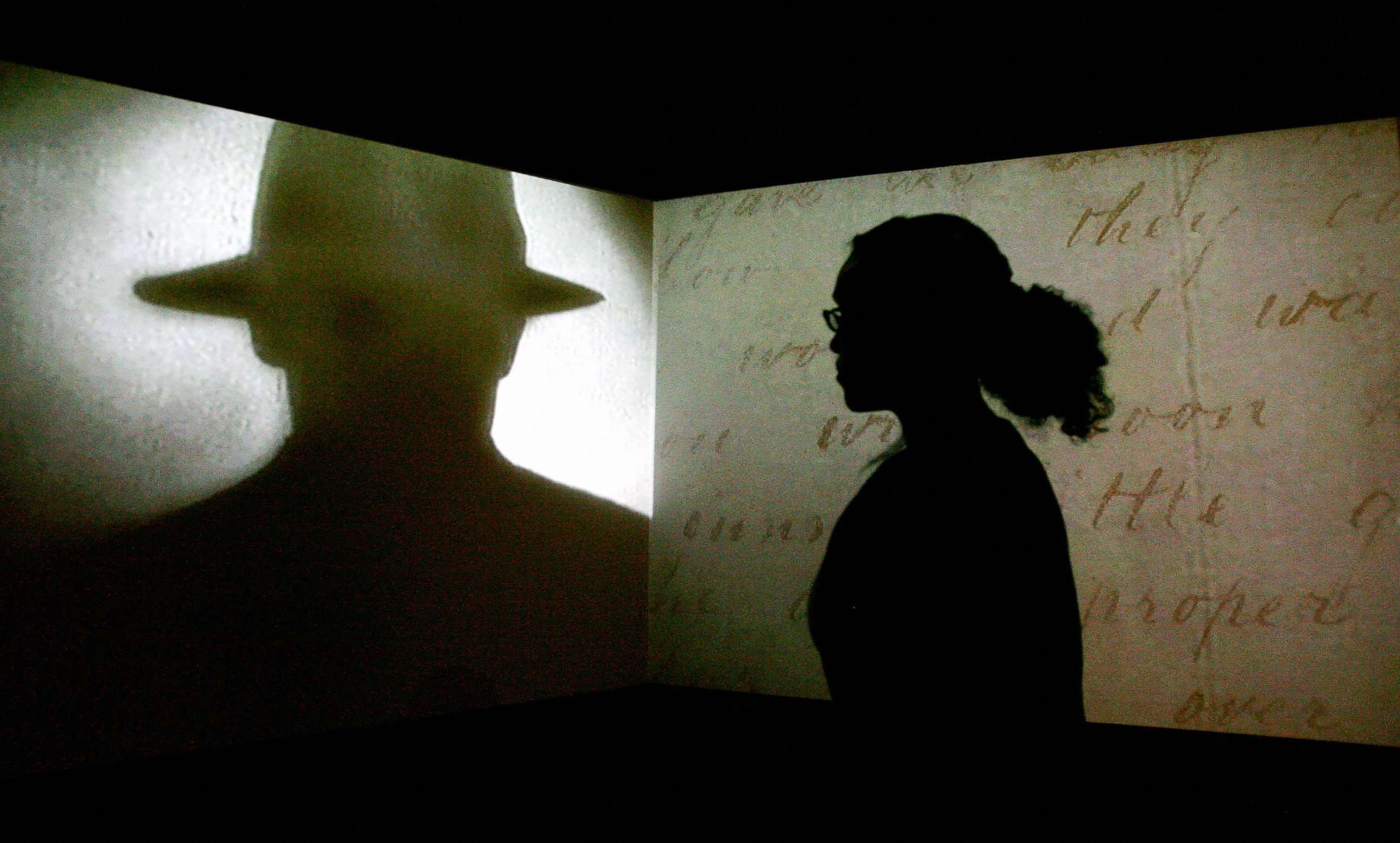 PHOTO: A visitor watches a black and white projection during a press preview of the "Jack the Ripper and the East End" exhibition at Museum in Docklands, in London, May 14, 2008.