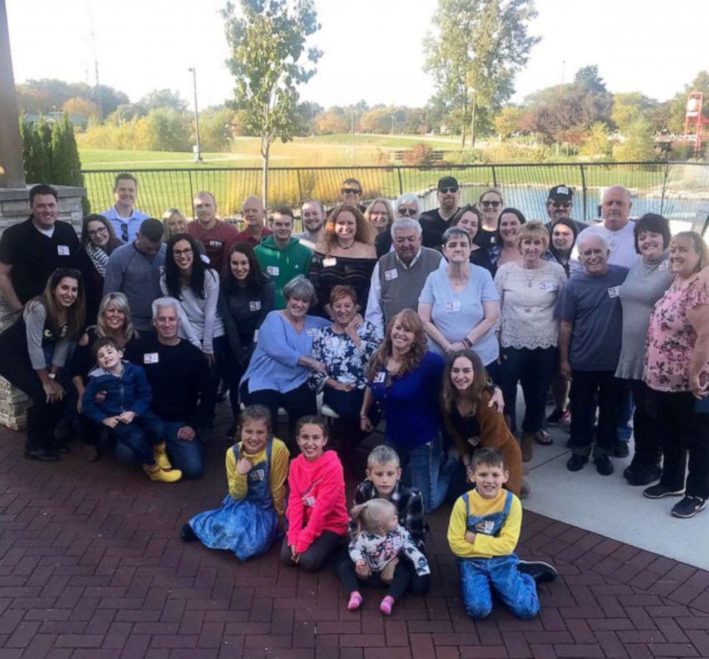 PHOTO: Jackie Murphy and Suzan Baekkelund, center in blue and floral shirts, celebrate their reunion after 75 years with their family. The women's mother experienced hardship and put Baeekkelund up for adoption.