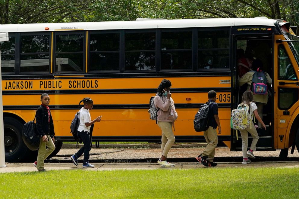 PHOTO: In this Sept. 6, 2022, file photo, Spann Elementary School students board a school bus in Jackson, Miss.