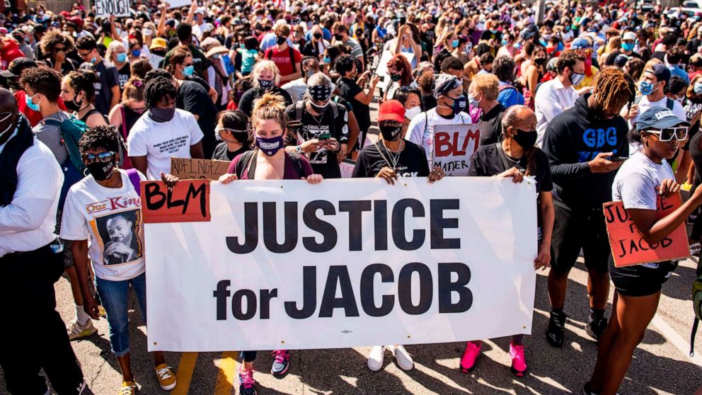 PHOTO: Protesters march with the family of Jacob Blake during a rally against racism and police brutality in Kenosha, Wisc., on Aug. 29, 2020. 