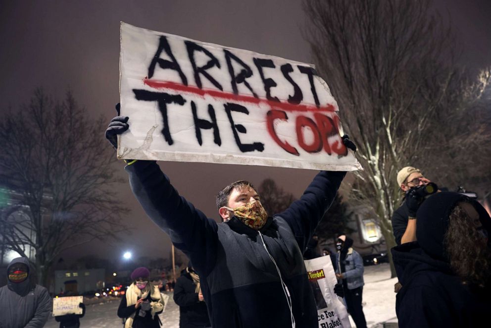 PHOTO: Activists show support for Jacob Blake Jr. during a vigil near the Kenosha County Courthouse on January 04, 2021 in Kenosha, Wis. 