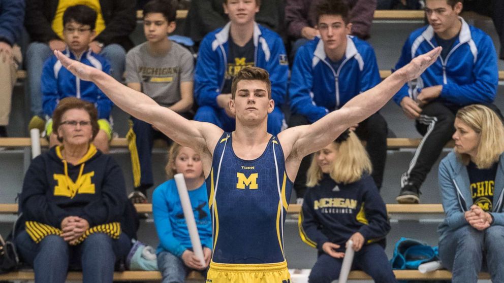 Jacob Moore, 18, seen competing in Ann Arbor, Mich., on Jan. 27, 2018, is a gymnast at the University of Michigan. He's joined a civil suit of more than 250 accusers against convicted doctor Larry Nassar, Michigan State University and USA Gymnastics.
