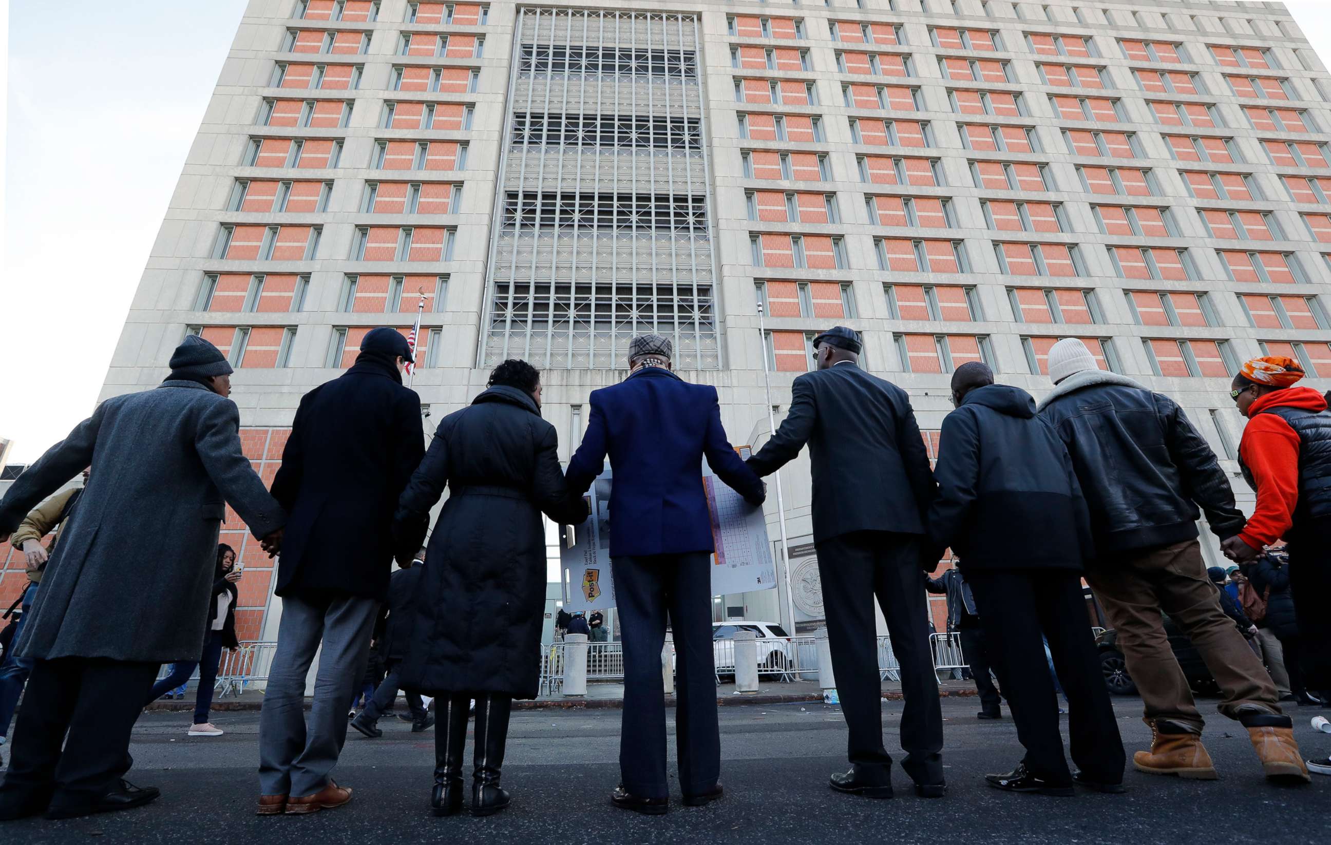 PHOTO: In this Feb. 3, 2019, file photo, community and religious leaders join hands to protest and pray outside the Metropolitan Detention Cente