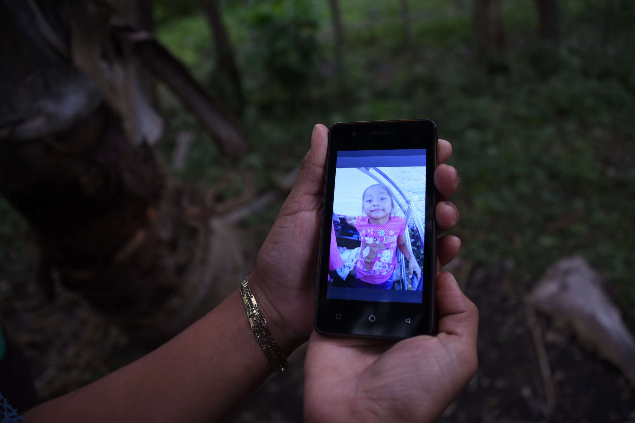 PHOTO: A relative shows a picture of 7-year old Jakelin Caal Maquin, who died in a Texas hospital two days after being taken into custody by border patrol agents, north of Guatemala city, Dec. 15, 2018. 