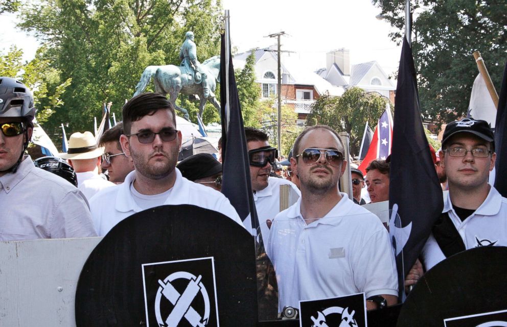 PHOTO: In this Aug. 12, 2017 photo, James Alex Fields Jr., second from left, holds a black shield in Charlottesville, Va., where a white supremacist rally took place. 