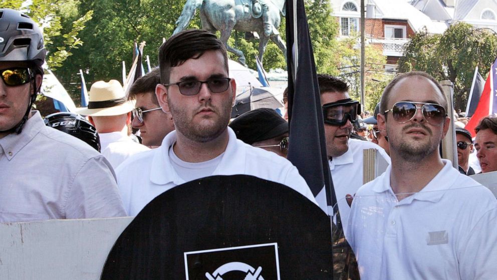 PHOTO: In this Aug. 12, 2017 photo, James Alex Fields Jr., second from left, holds a black shield in Charlottesville, Va., where a white supremacist rally took place. 