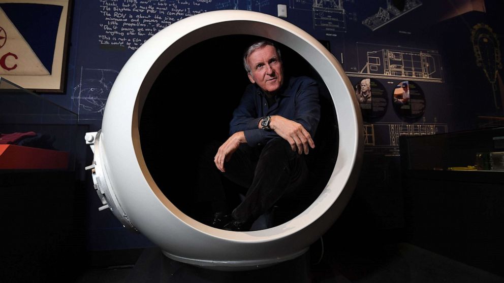 PHOTO: In this May 28, 2018, file photo, deep-sea explorer and Academy Award-winning filmmaker James Cameron sits in a scale model of the Deepsea Challenger's pilot chamber at an exhibition about his history-making deep-sea expeditions, in Sydney.