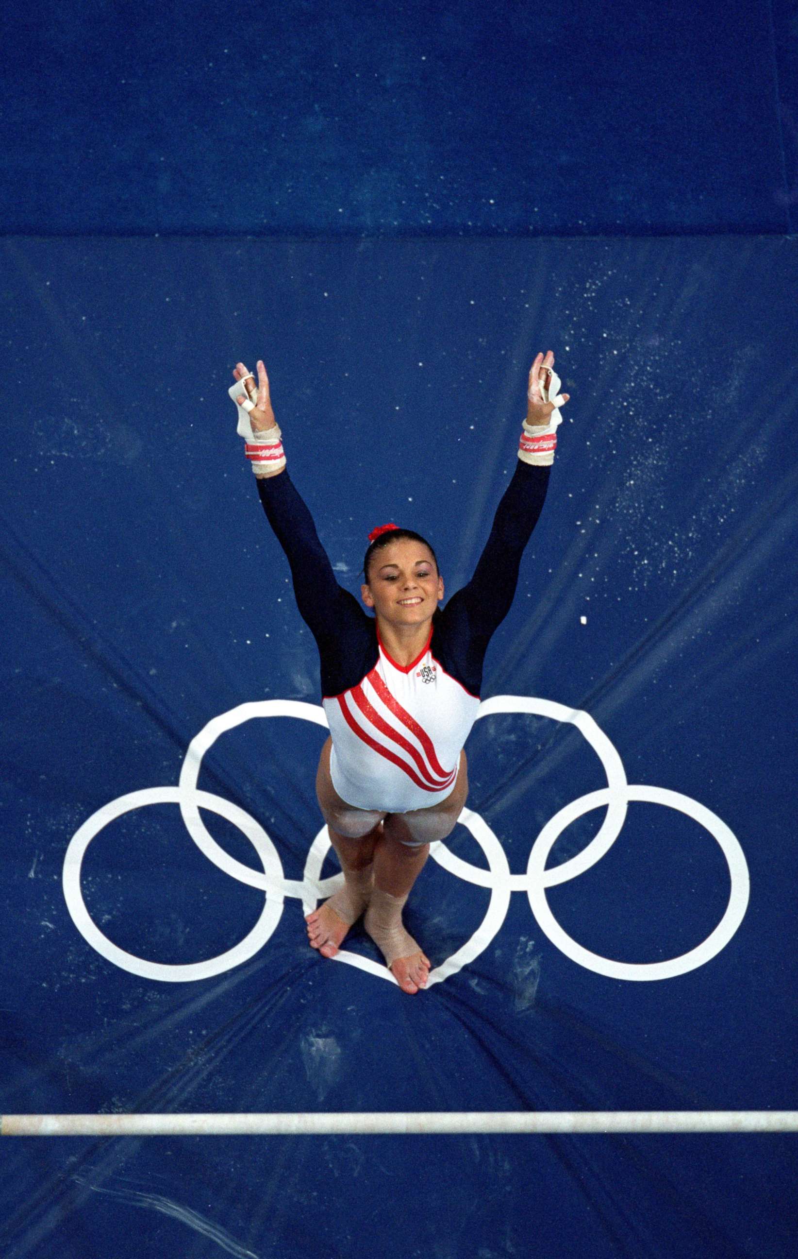 PHOTO: Jamie Dantzscher of the United States dismounts from the uneven bars during the Women's Gymnastics competition in the 2000 Olympics held in Sydney, Australia, Sept. 19, 2000.