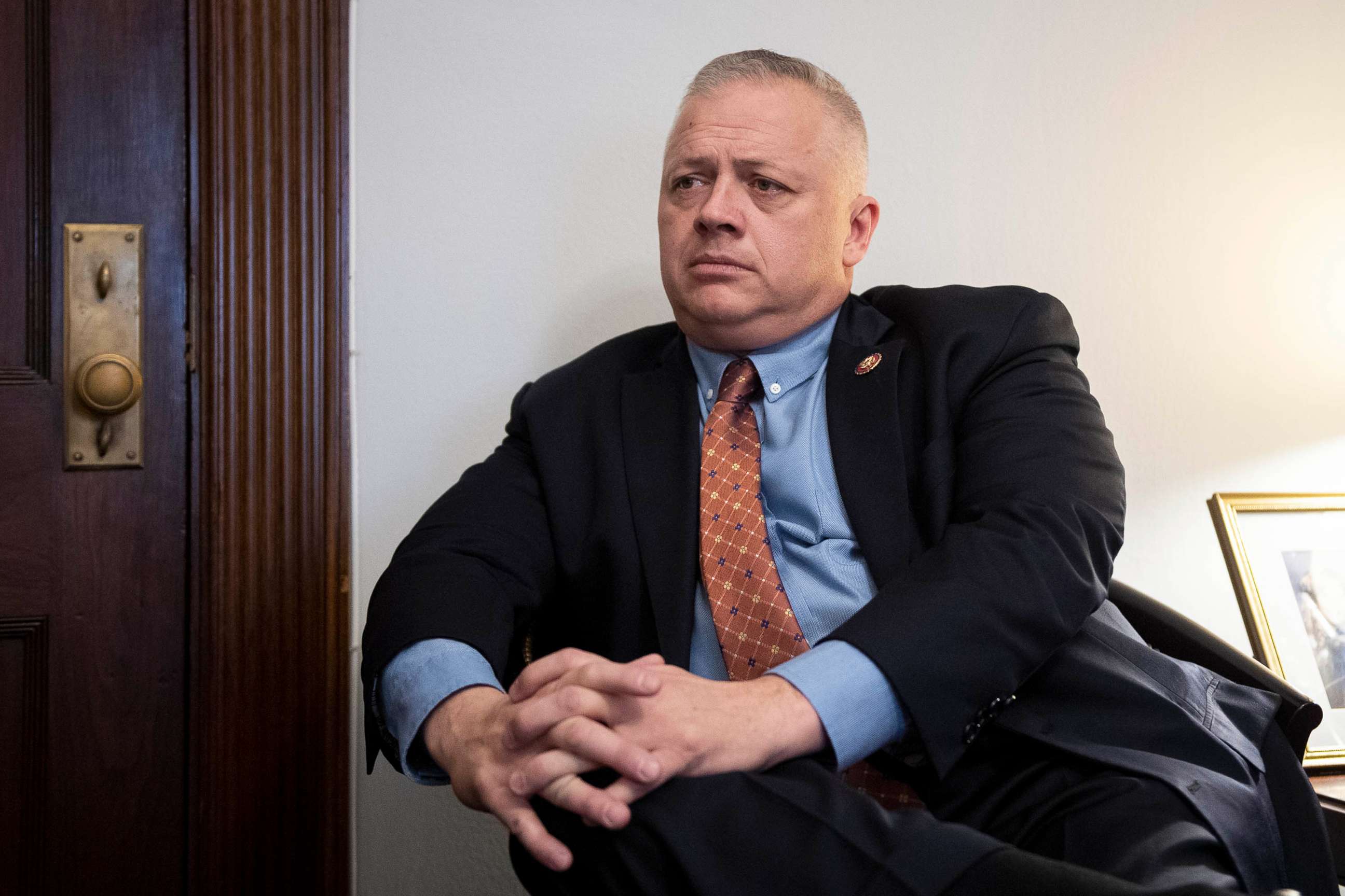 PHOTO: Rep. Denver Riggleman speaks with a reporter in his office in Washington, Feb. 26, 2020. 