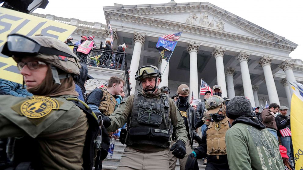 PHOTO: Rioters march down the steps of the Capitol protesting against the certification of the 2020 presidential election results by the U.S. Congress, in Washington, Jan. 6, 2021.