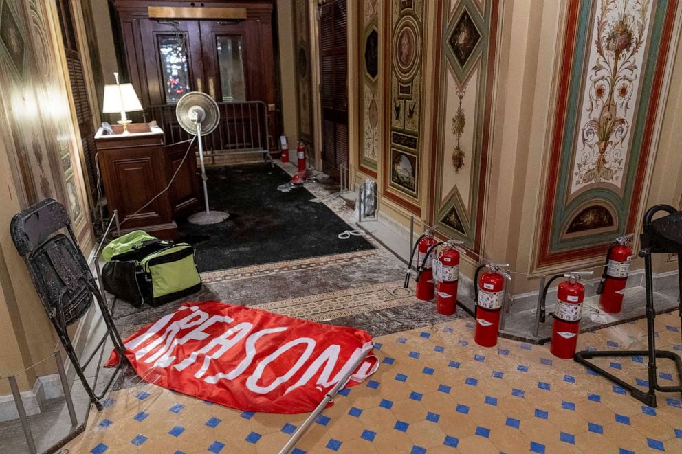 PHOTO: A flag that reads "Treason" is visible on the ground in the early morning hours of Jan. 7, 2021, after rioters stormed the Capitol in Washington.