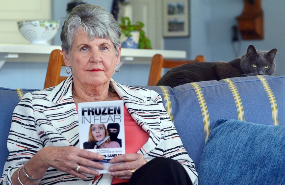 PHOTO: Rape survivor Jane Carson-Sandler, of Sun City Hilton Head, S.C. poses for a photo holding a copy of her book about the experience called, "Frozen in Fear." 