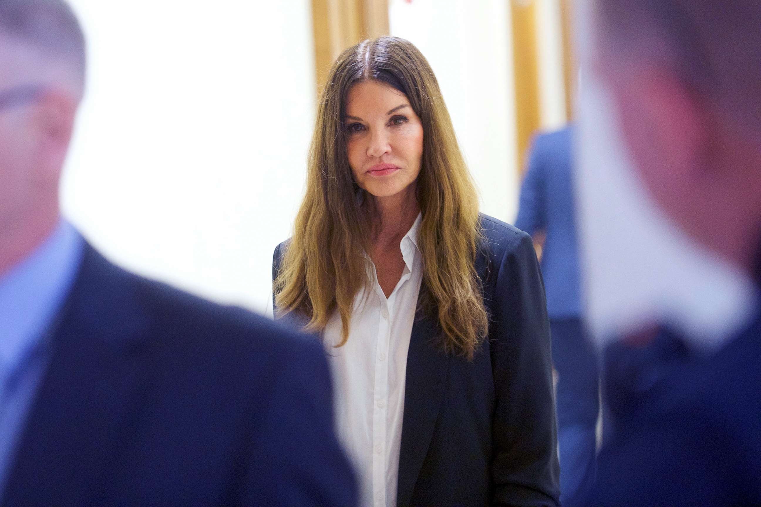 PHOTO: Model Janice Dickinson, walks through the Montgomery County Courthouse while on a break from testifying against actor and comedian Bill Cosby during the fourth day of his sexual assault retrial case in Norristown, Pa., April 12, 2018.