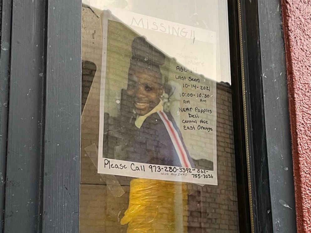 PHOTO: A missing poster for 14-year-old Jashyah Moore hangs in a drive-through window at a fast food restaurant in East Orange, N.J., Oct. 16, 2021.