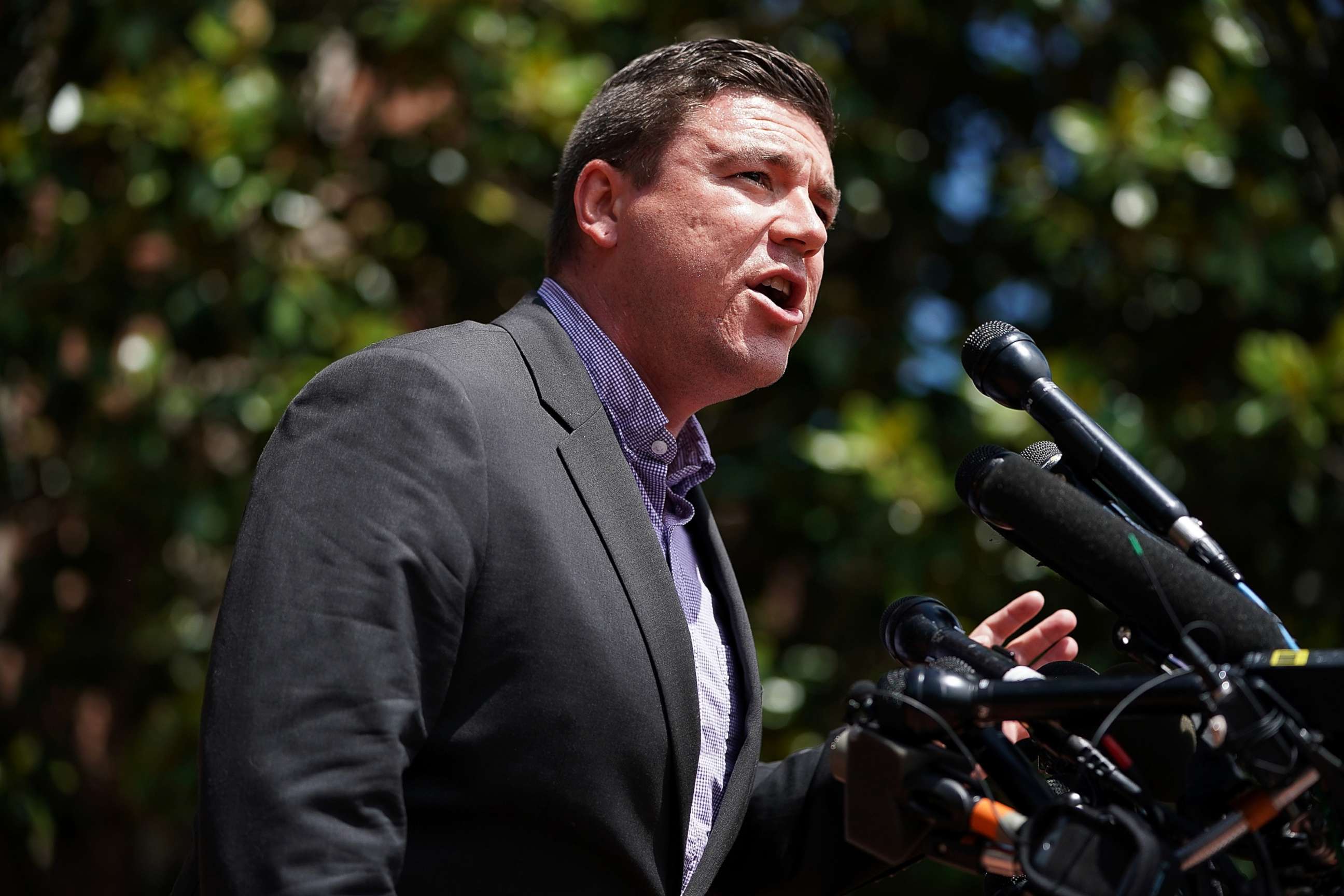 PHOTO: Jason Kessler, an organizer of Unite the Right rally, tries to speak while being shouted down by counter-protesters outside the Charlottesville City Hall, Aug. 13, 2017 in Charlottesville, Va. 