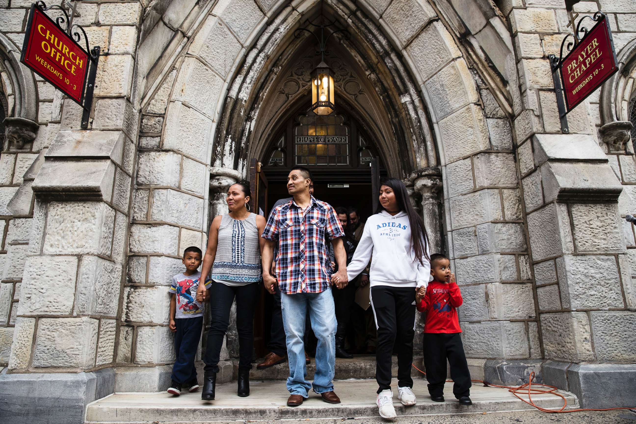 PHOTO: Javier Flores Garcia, center, emerges from the Arch Street United Methodist Church, accompanied by his wife, Alma Lopez, daughter, Adamaris and sons, Javier, left, and Yael, in Philadelphia, Oct. 11, 2017. 