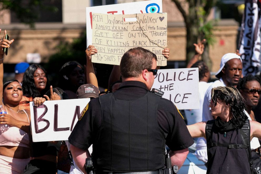 PHOTO: Demonstrators standoff with Akron Sheriff's officers outside Akron City Hall as they protest the killing of Jayland Walker, shot by police, in Akron, Ohio, July 3, 2022.